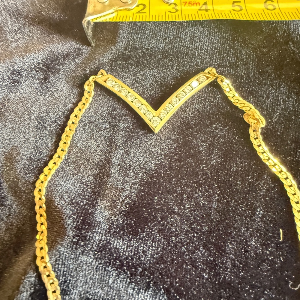 Gold V-Shaped Necklace with 16 diamonds